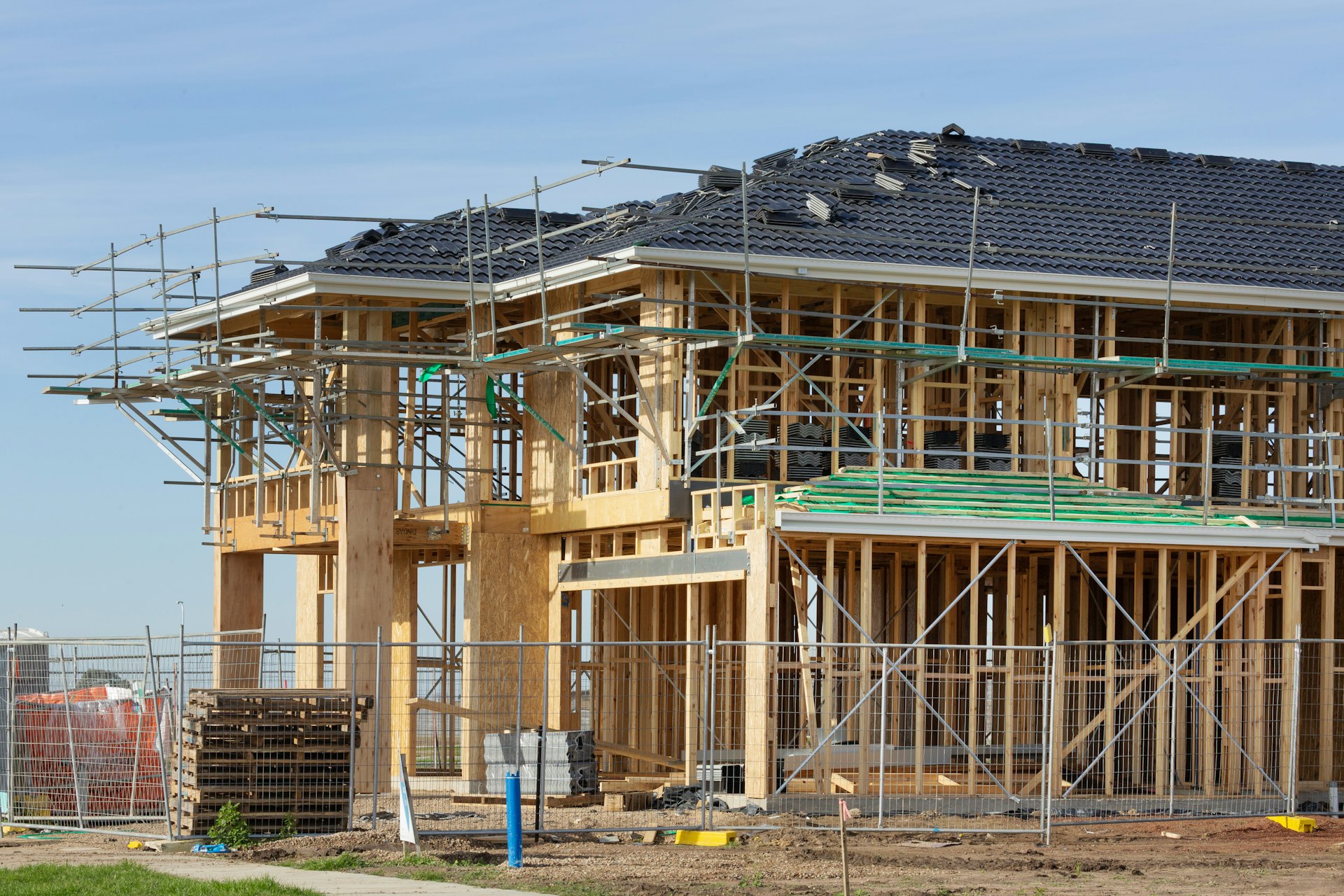 New residential house under construction with timber roof framing