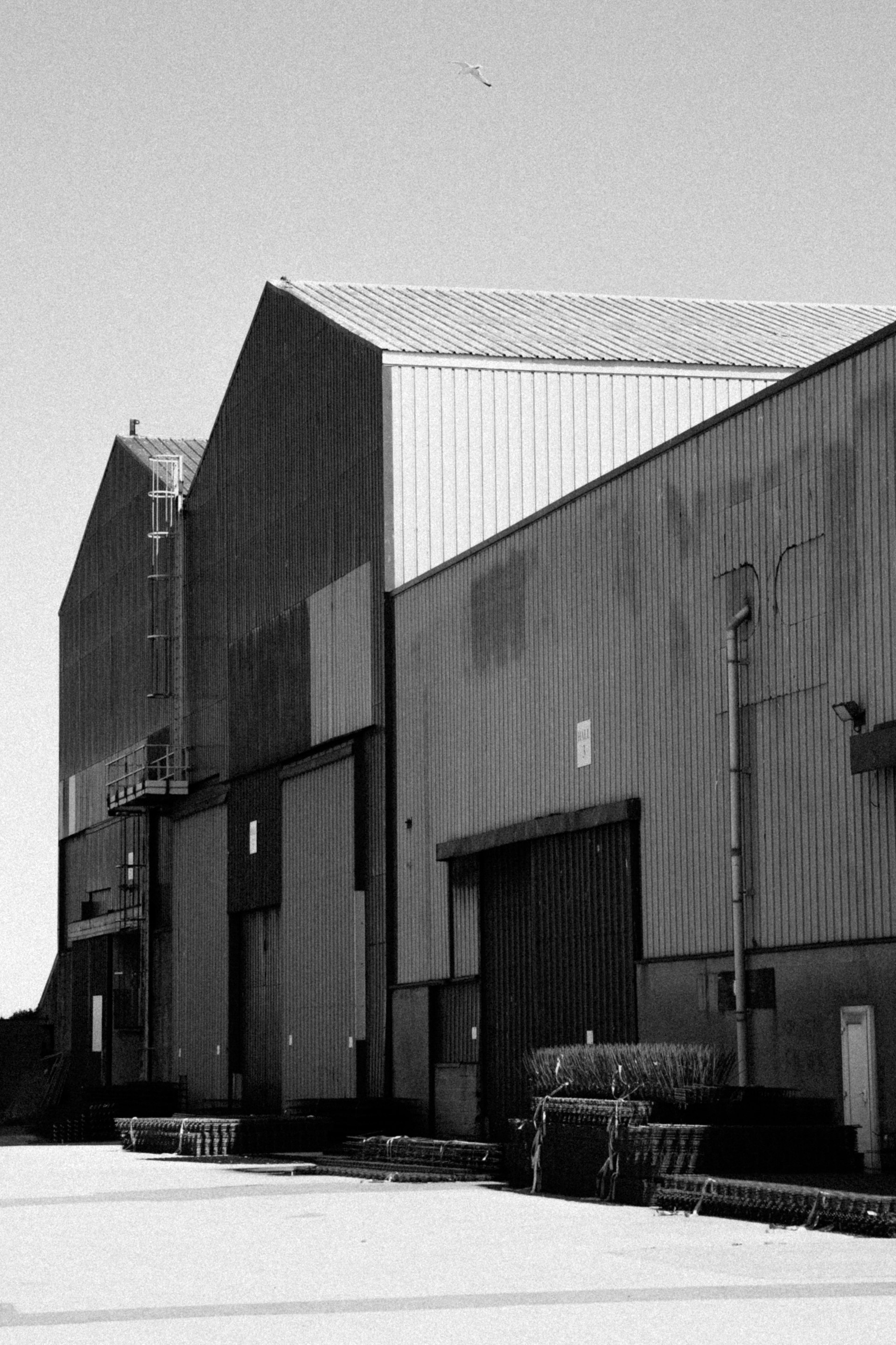 Pre-engineered steel buildings with corrugated metal cladding